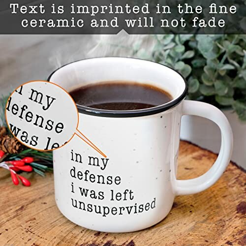 Ceramic coffee mug with text 'in my defense I was left unsupervised'.