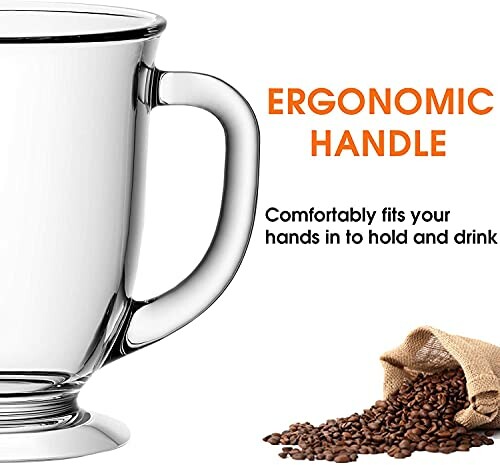 Glass coffee mug with ergonomic handle and coffee beans.