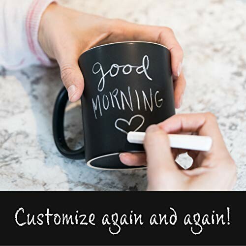 Hands writing on a chalkboard mug with 'Good Morning' text.