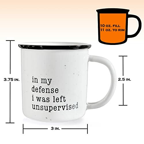 White ceramic mug with text 'in my defense I was left unsupervised' and size details.