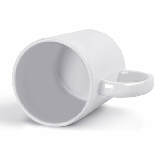 White coffee mug lying on its side