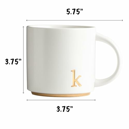 White mug with letter 'k' and measurements